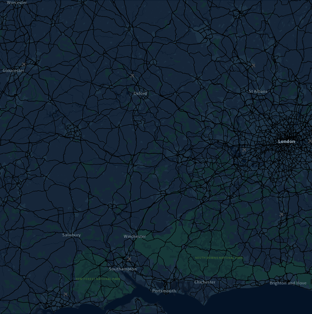 Animated GIF of Ordnance Survey’s visualization showing 12 hours of 999 incidents for South Central Ambulance Service on New Year’s Eve 2018. The map uses a dark night-style background with proportional circles sized by time spent at each incident. Circles are colored red for severe incidents and blue for non-severe, appearing and fading over time to illustrate the pattern of emergency calls